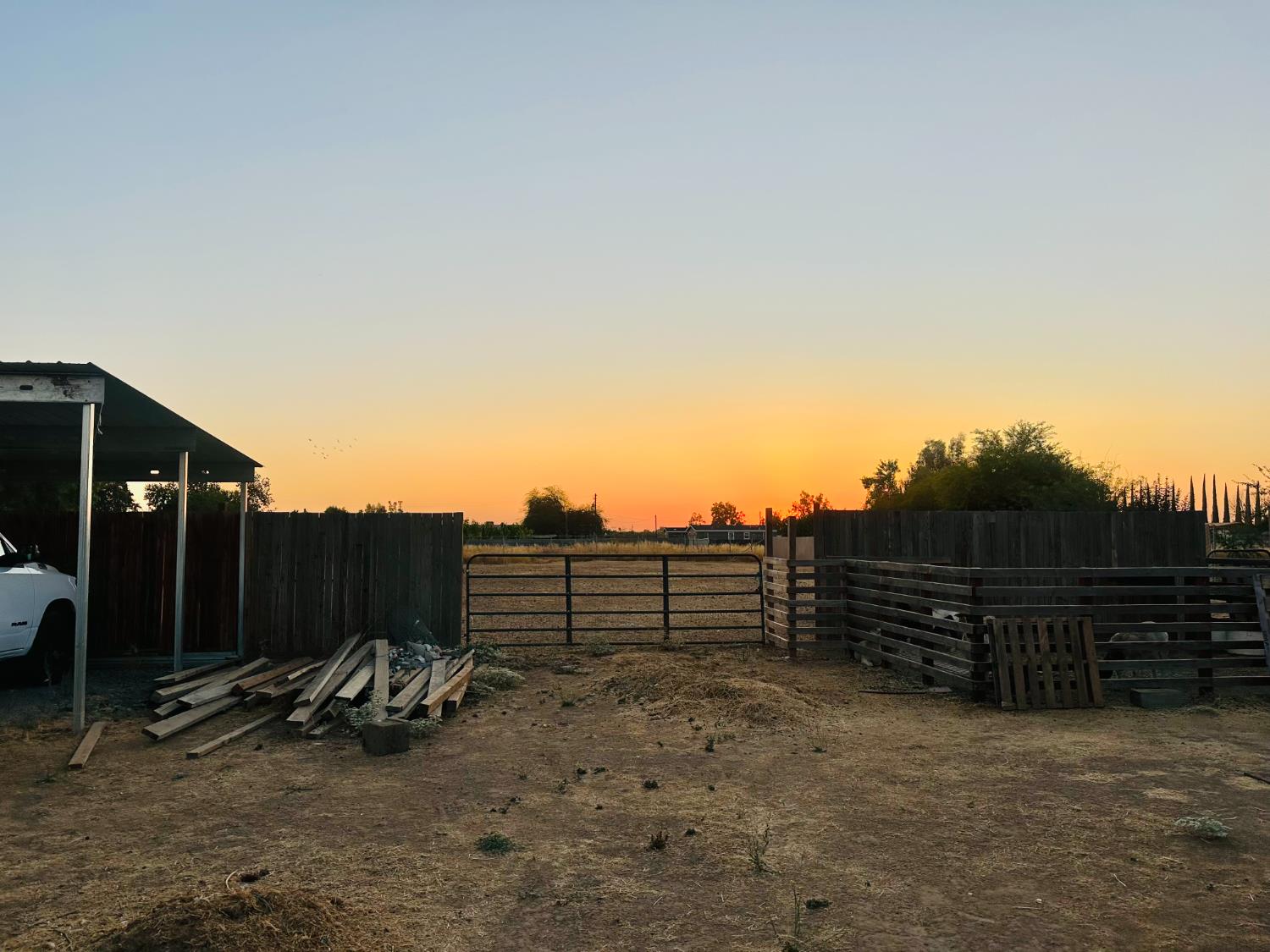 22788 Maple Street Chowchilla, CA 93610 - Photo 13 of 20 a view of outdoor space with wooden floor and wall