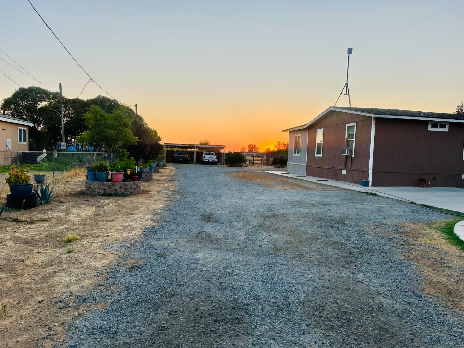 22788 Maple Street Chowchilla, CA 93610 - Photo 6 of 20 a view of a house with a yard