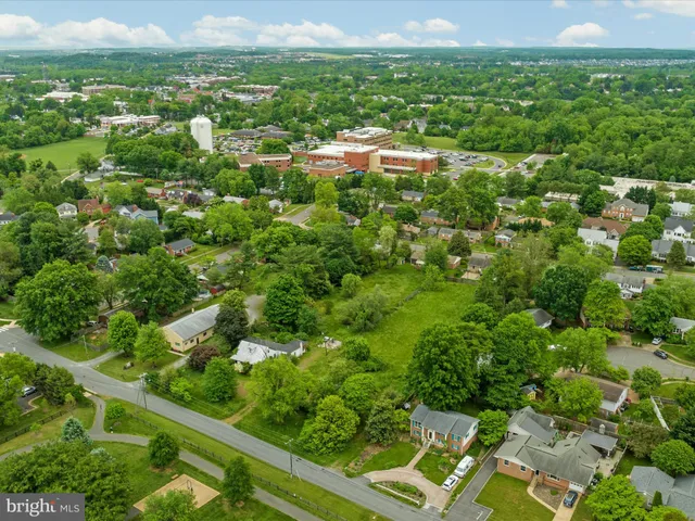 a aerial view of a house with a yard