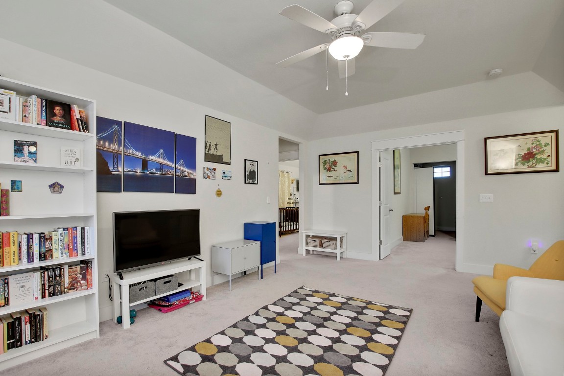 13001 Hymeadow Drive, Unit 39 Austin, TX 78729 - Photo 27 of 39 a living room with furniture and a flat screen tv