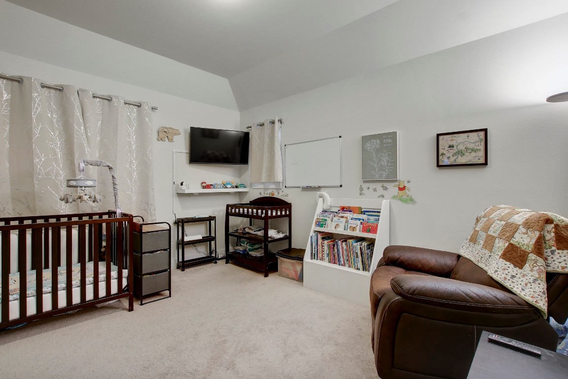13001 Hymeadow Drive, Unit 39 Austin, TX 78729 - Photo 31 of 39 a living room with furniture and a flat screen tv