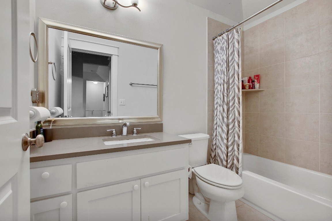 13001 Hymeadow Drive, Unit 39 Austin, TX 78729 - Photo 36 of 39 a bathroom with a toilet sink vanity tub and shower