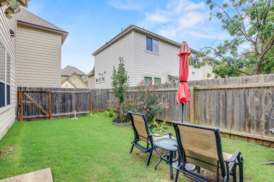 13001 Hymeadow Drive, Unit 39 Austin, TX 78729 - Photo 37 of 39 a view of a chair and table in backyard of the house