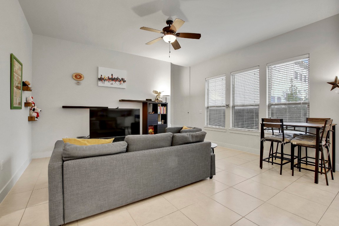 13001 Hymeadow Drive, Unit 39 Austin, TX 78729 - Photo 7 of 39 a living room with furniture and a fireplace