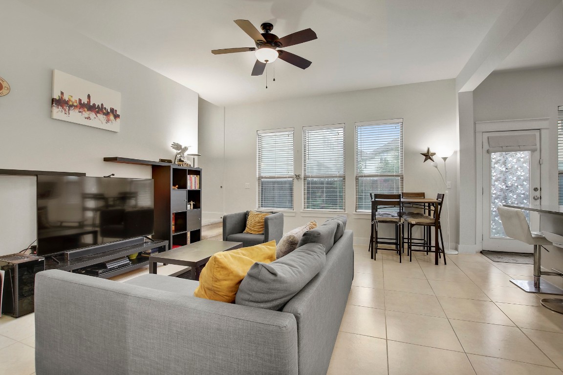 13001 Hymeadow Drive, Unit 39 Austin, TX 78729 - Photo 8 of 39 a living room with furniture and a flat screen tv