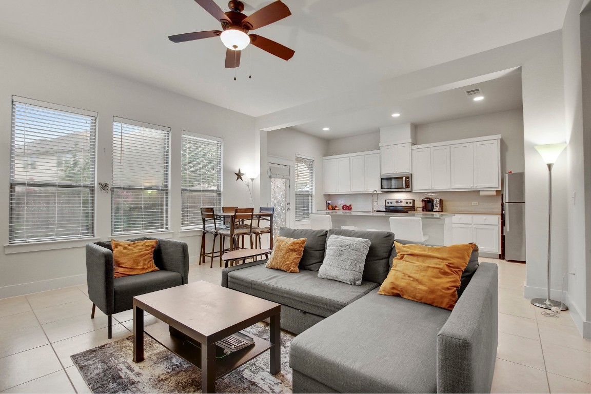 13001 Hymeadow Drive, Unit 39 Austin, TX 78729 - Photo 9 of 39 a living room with furniture and a large window