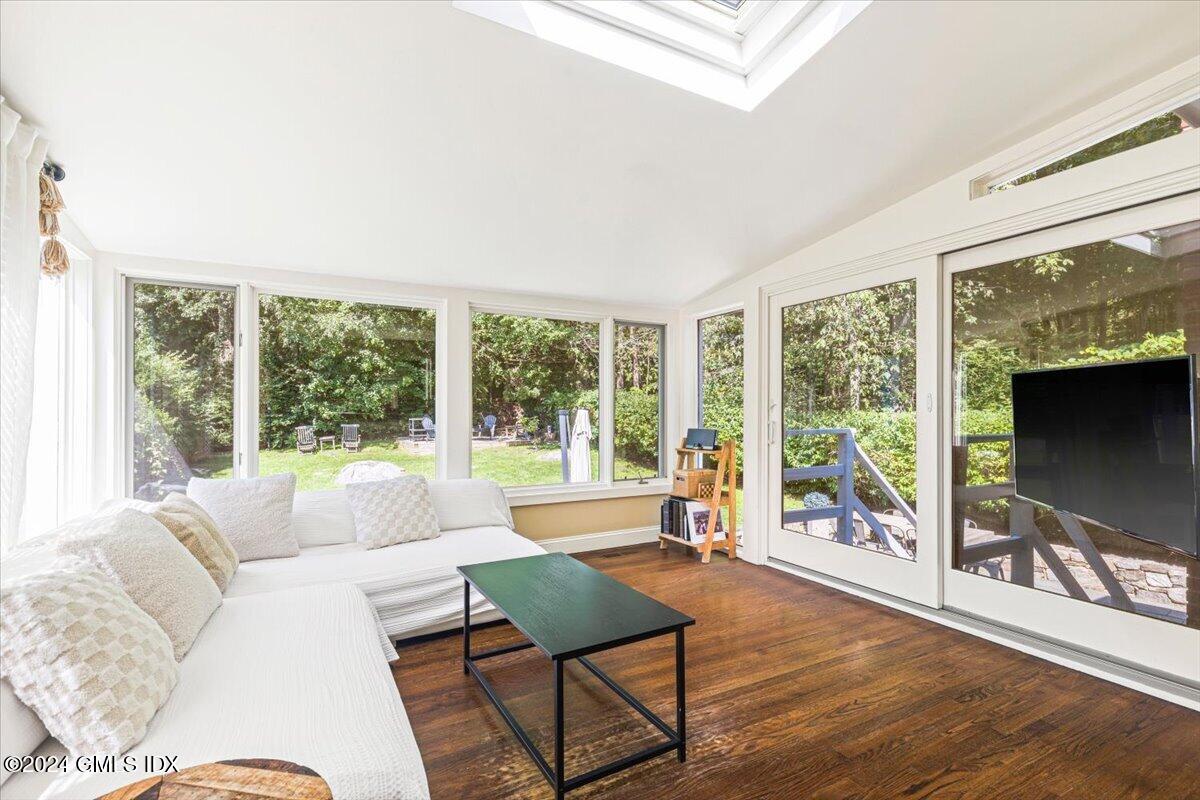 70 Gregory Road Cos Cob, CT 06807 - Photo 11 of 39 a living room with furniture and a floor to ceiling window