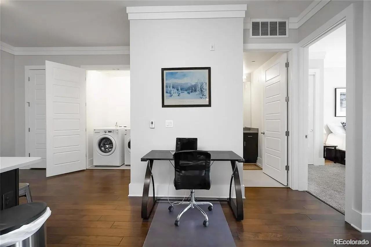 708 13th Street, Unit 250 Golden, CO 80401 - Photo 11 of 27 a view of a workspace with furniture and wooden floor