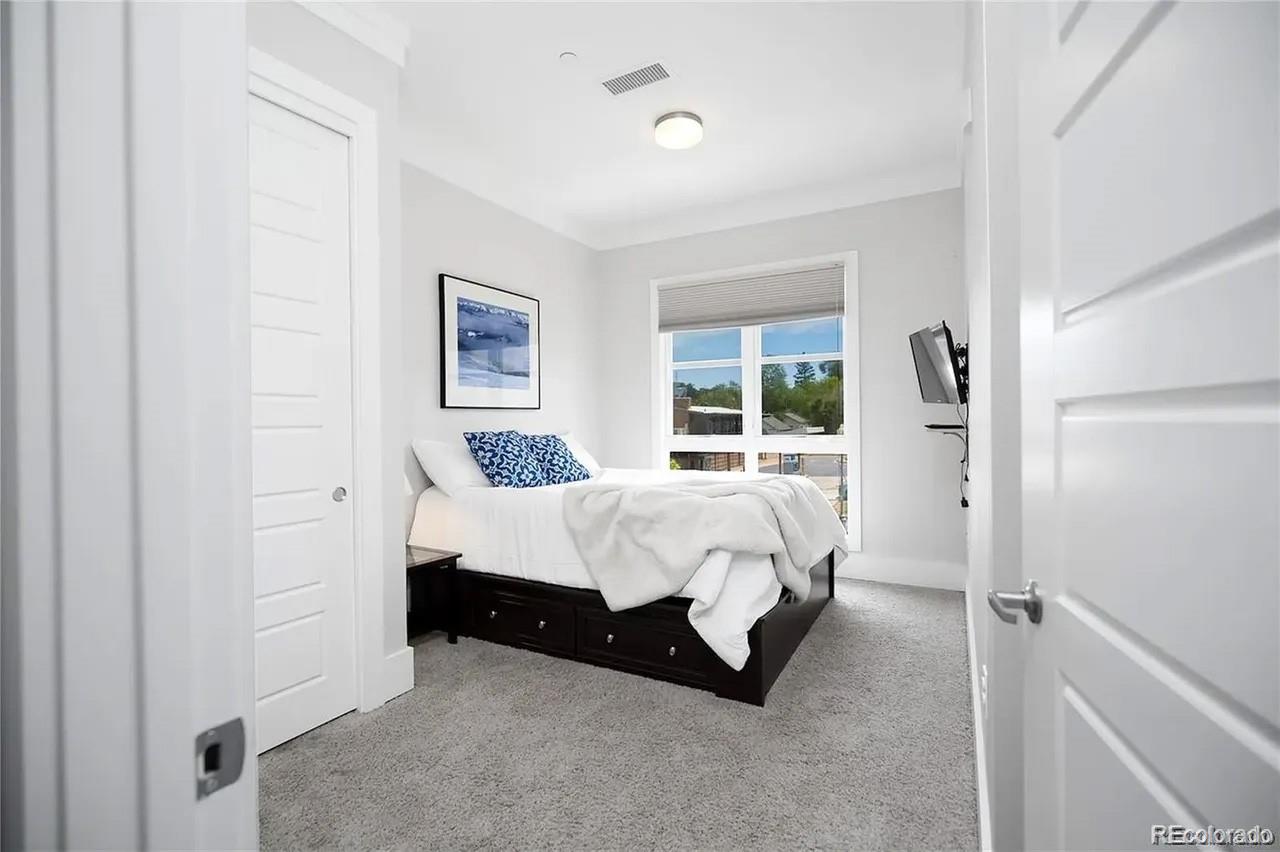 708 13th Street, Unit 250 Golden, CO 80401 - Photo 13 of 27 a bed room with a bed and a window