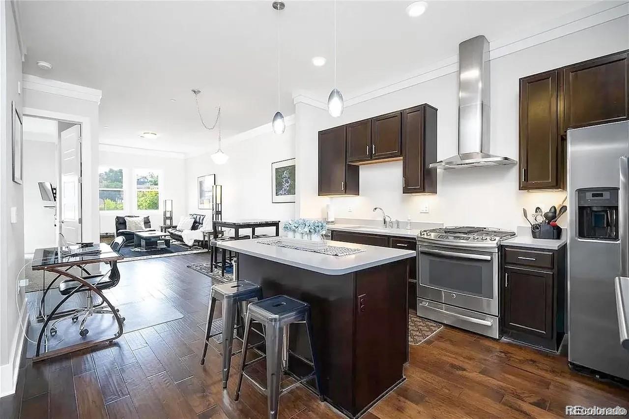 708 13th Street, Unit 250 Golden, CO 80401 - Photo 6 of 27 a kitchen with counter top space a sink appliances and cabinets