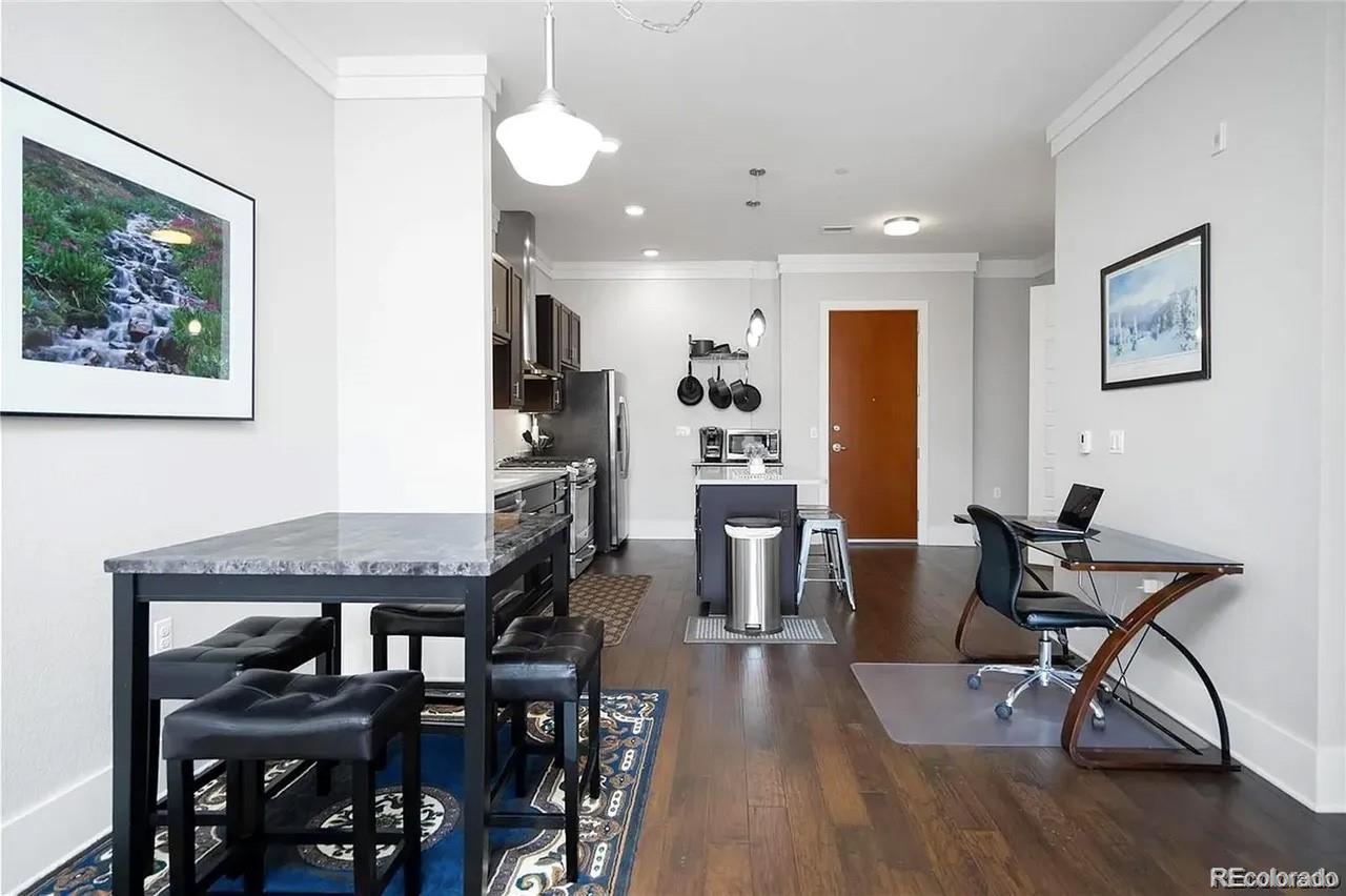 708 13th Street, Unit 250 Golden, CO 80401 - Photo 8 of 27 a view of a dining room with furniture and wooden floor