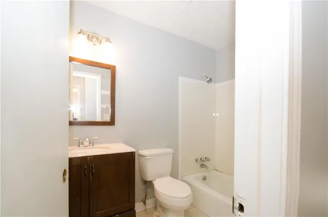 a bathroom with a shower and a toilet