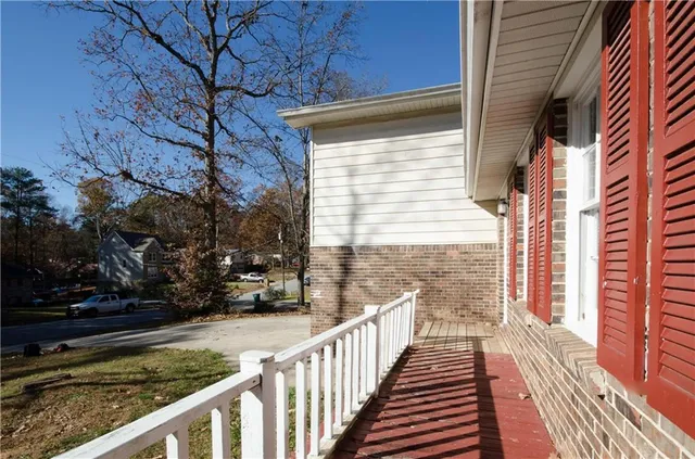 a view of a pathway of a house with a yard