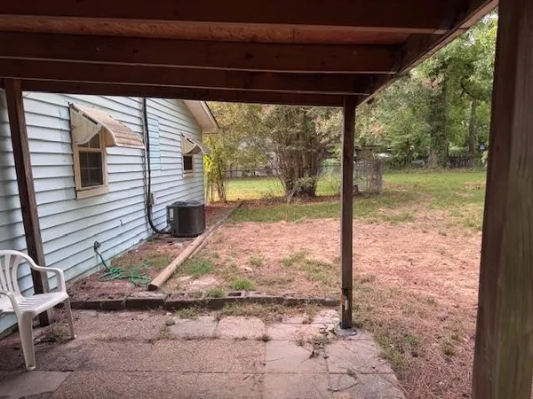 a view of a porch with a bench in patio