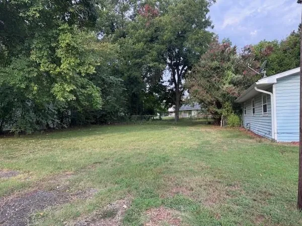 a view of outdoor space with deck and yard