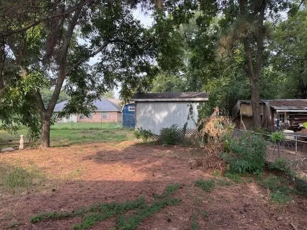 a view of backyard with green space