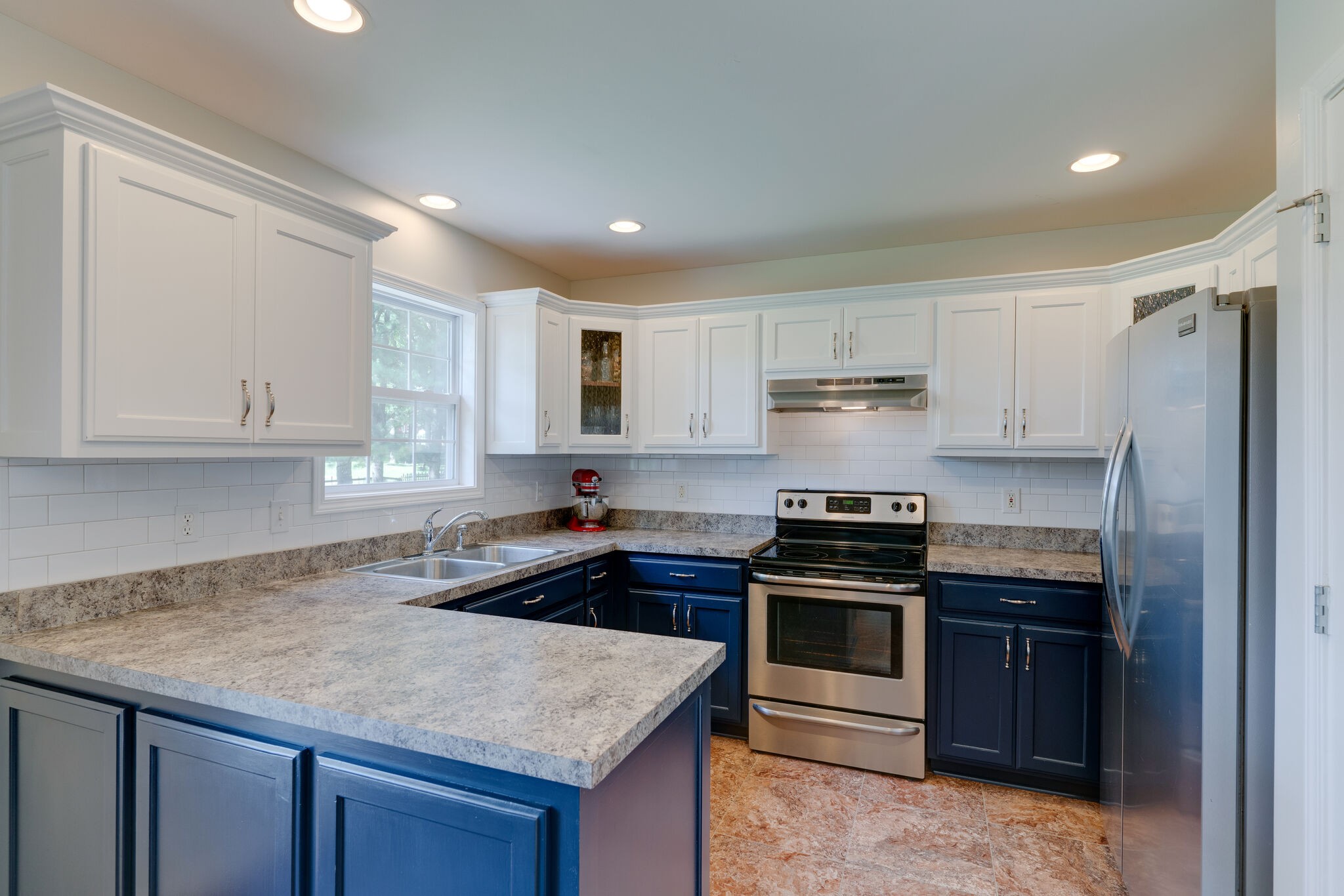 310 Lenox Court Springfield, TN 37172 - Photo 5 of 12 a kitchen with granite countertop a sink stove and refrigerator