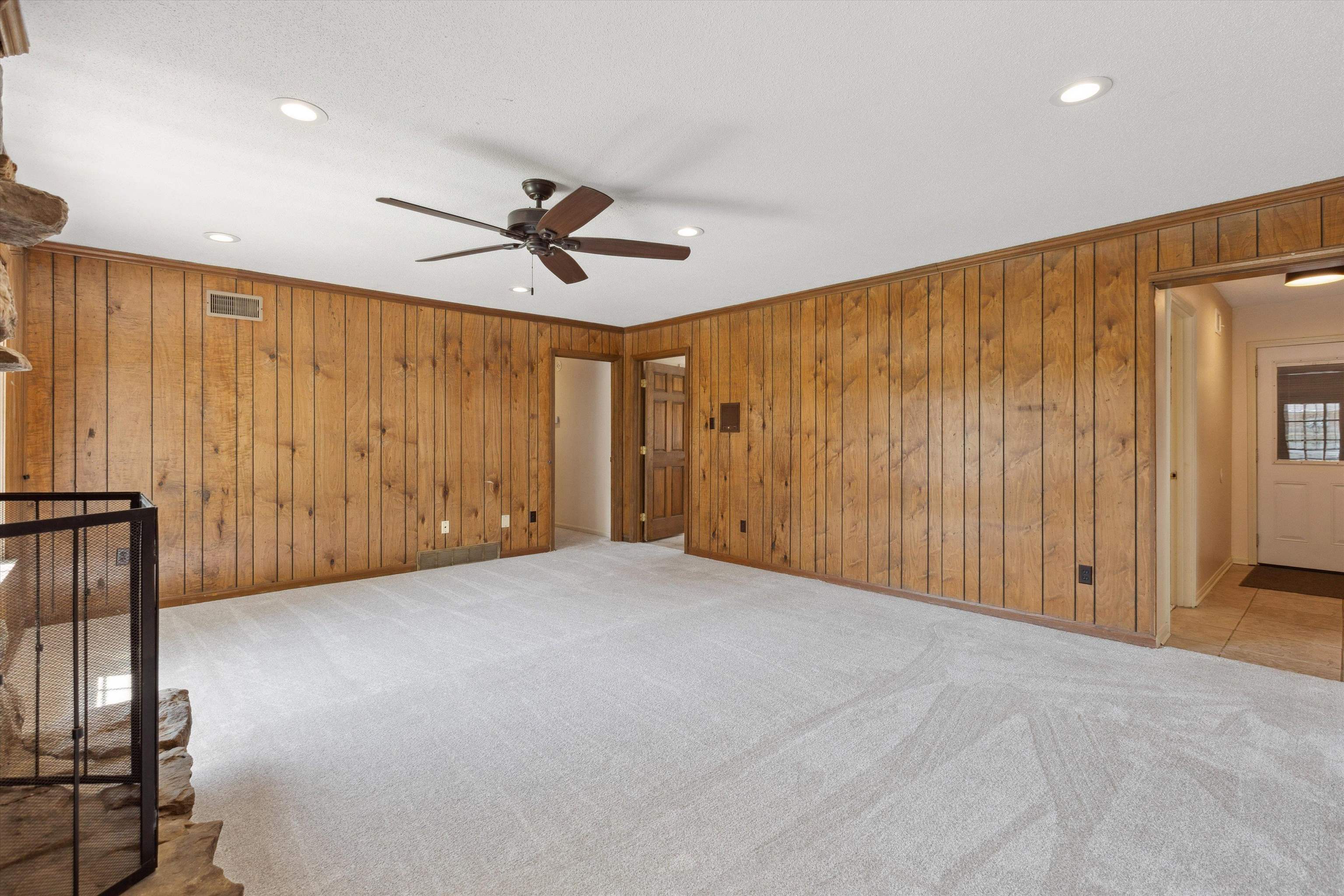 5747 Bartlett Woods Drive Bartlett, TN 38134 - Photo 13 of 28 Unfurnished room featuring recessed lighting, wooden walls, a ceiling fan, carpet floors, and visible vents