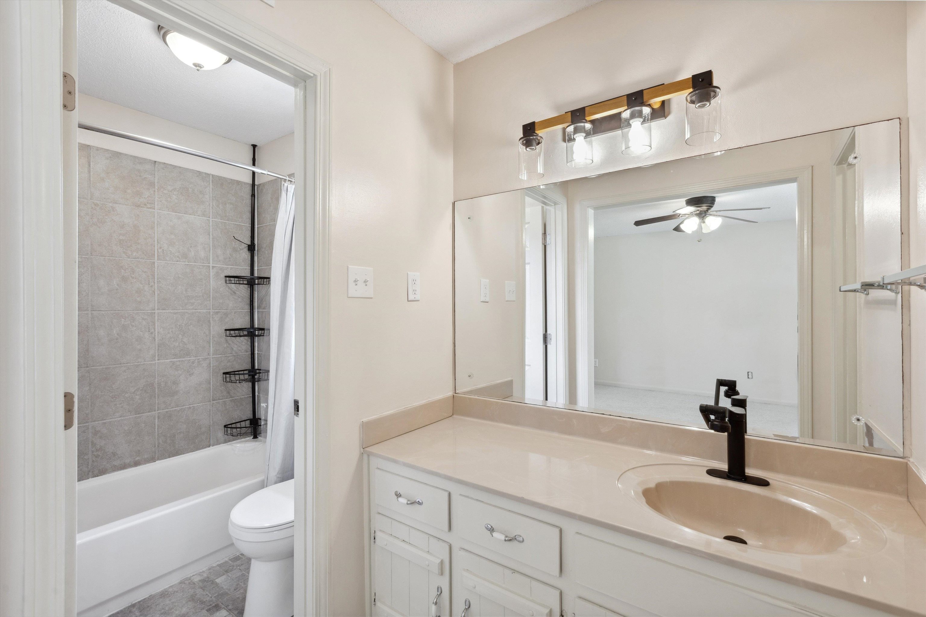5747 Bartlett Woods Drive Bartlett, TN 38134 - Photo 21 of 28 Full bathroom with toilet, shower / tub combo, vanity, and a ceiling fan