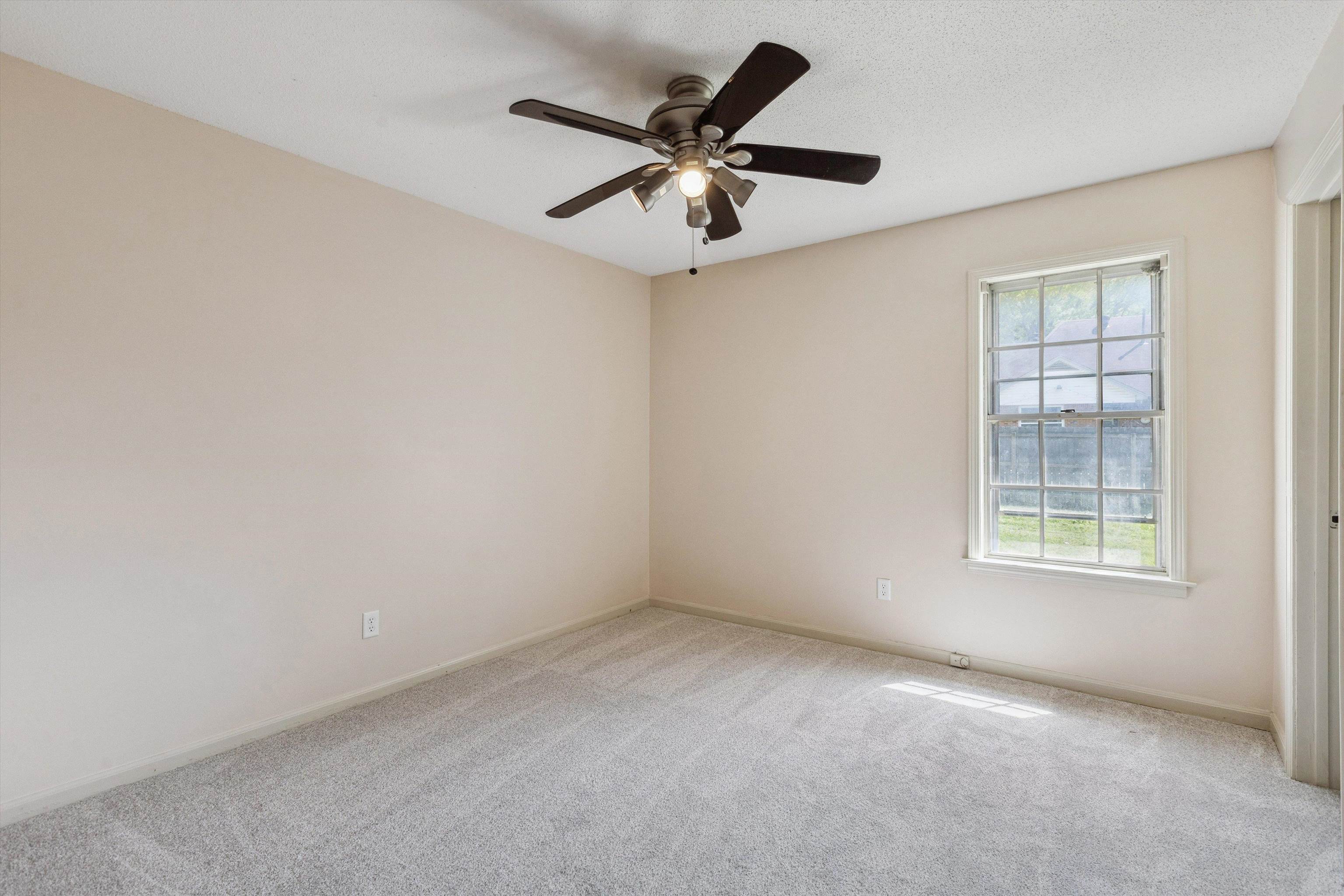 5747 Bartlett Woods Drive Bartlett, TN 38134 - Photo 26 of 28 Empty room with carpet flooring, baseboards, and ceiling fan
