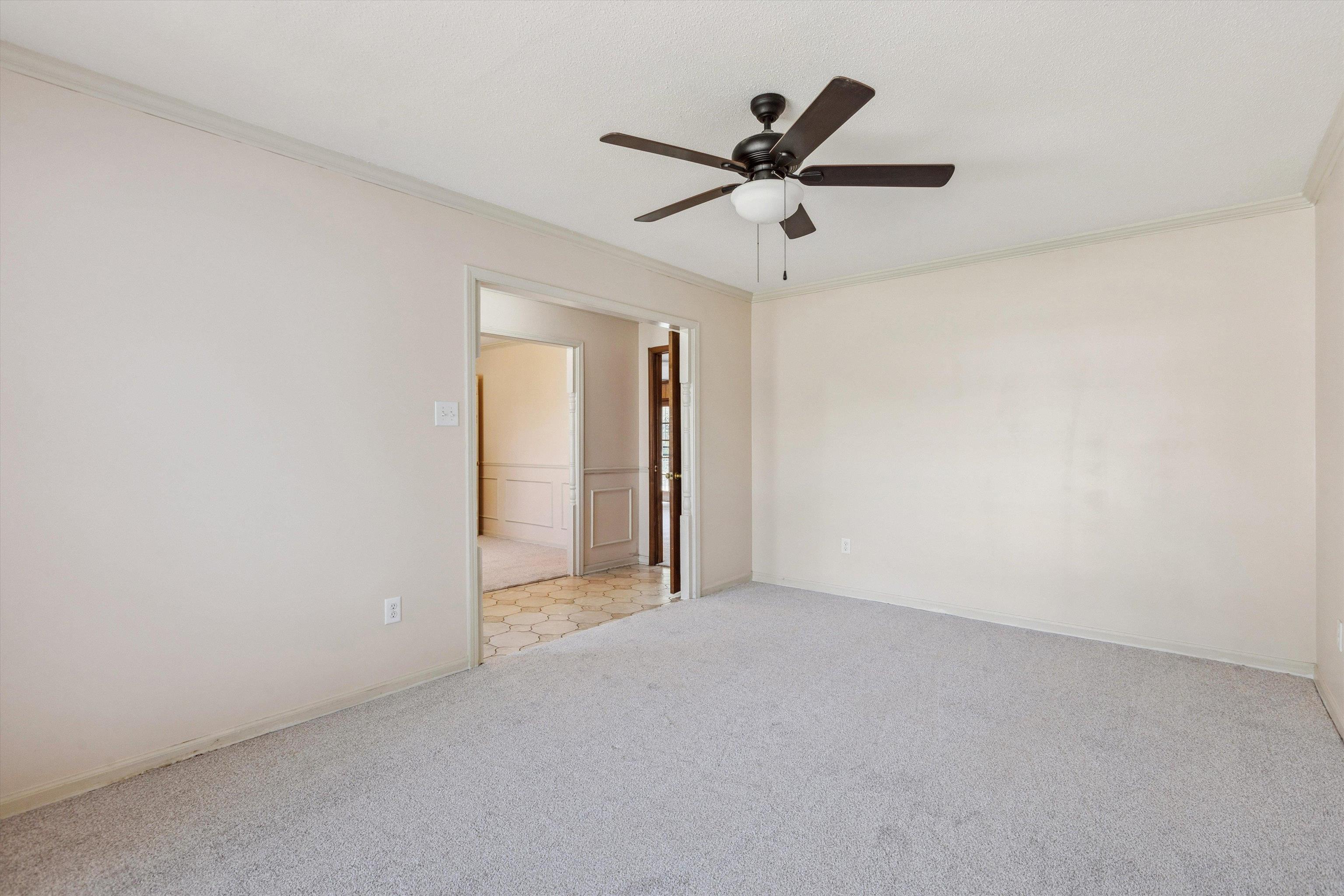 5747 Bartlett Woods Drive Bartlett, TN 38134 - Photo 9 of 28 Carpeted spare room featuring crown molding and ceiling fan
