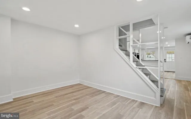 a view of entryway with wooden floor