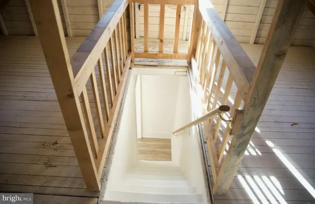 a front view of a house with wooden floor and door