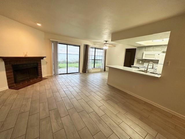 4472 Chaha Road, Unit 104 Garland, TX 75043 - Photo 2 of 7 a view of a livingroom with an empty space and a fireplace
