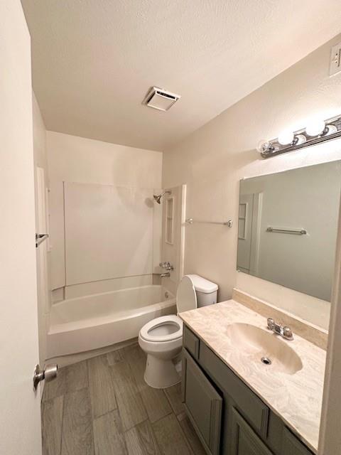 4472 Chaha Road, Unit 104 Garland, TX 75043 - Photo 6 of 7 a bathroom with a granite countertop sink a toilet and shower