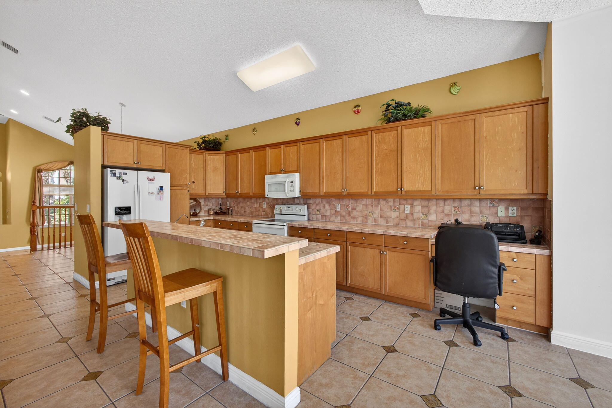 2008 Reston Circle Royal Palm Beach, FL 33411 - Photo 21 of 57 a kitchen with a sink cabinets and wooden floor