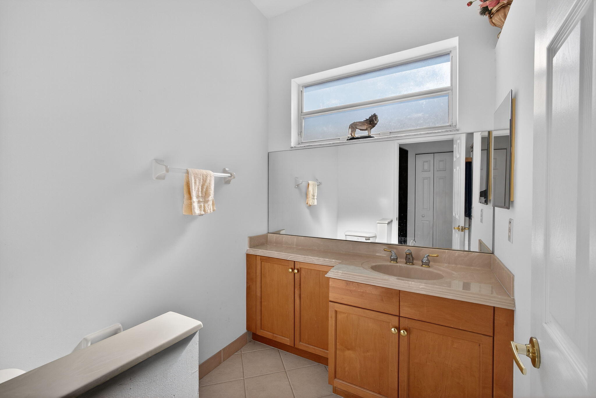 2008 Reston Circle Royal Palm Beach, FL 33411 - Photo 37 of 57 a bathroom with a sink and a mirror