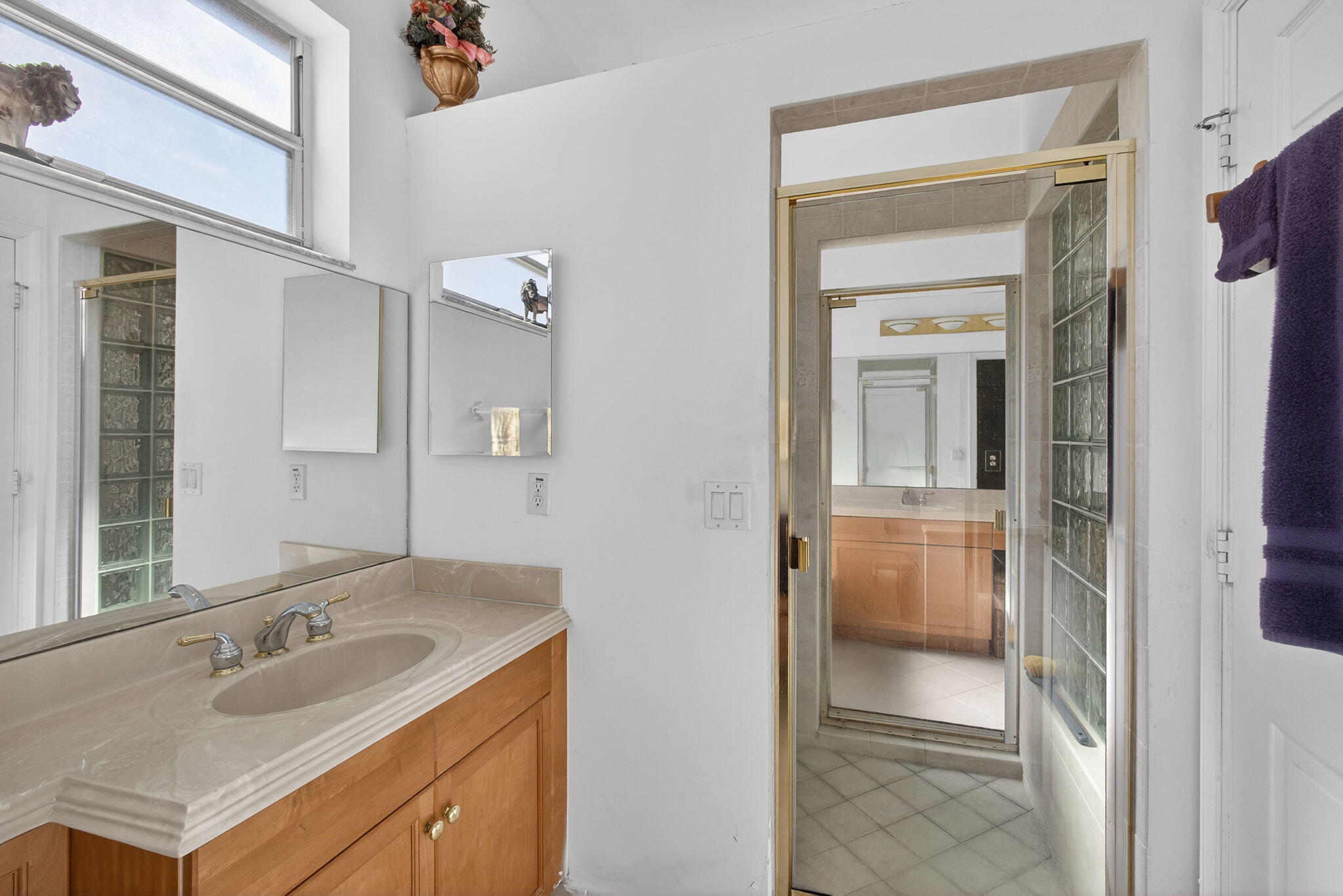2008 Reston Circle Royal Palm Beach, FL 33411 - Photo 38 of 57 a bathroom with a sink and a mirror