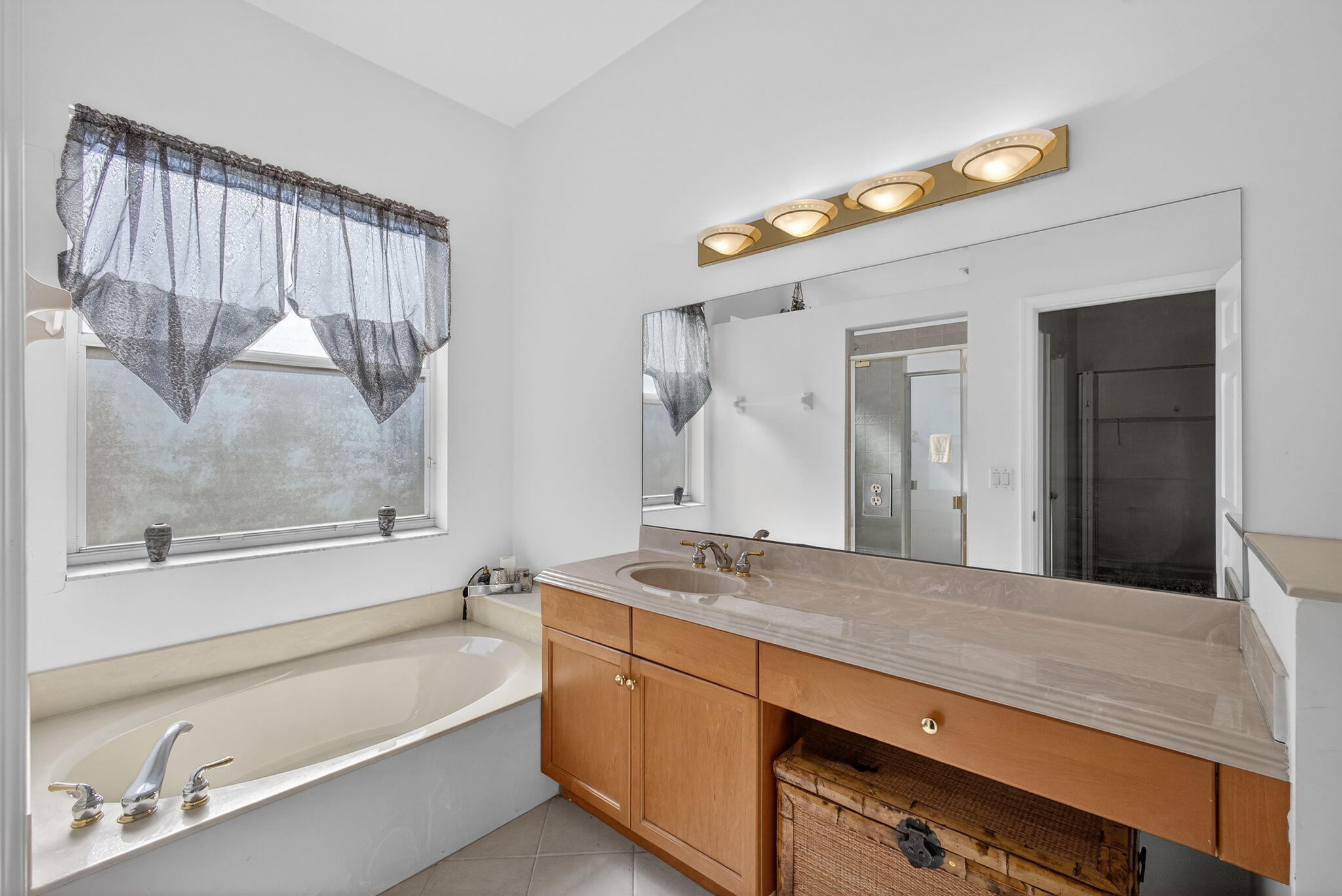 2008 Reston Circle Royal Palm Beach, FL 33411 - Photo 39 of 57 a bathroom with a granite countertop sink mirror and a bathtub