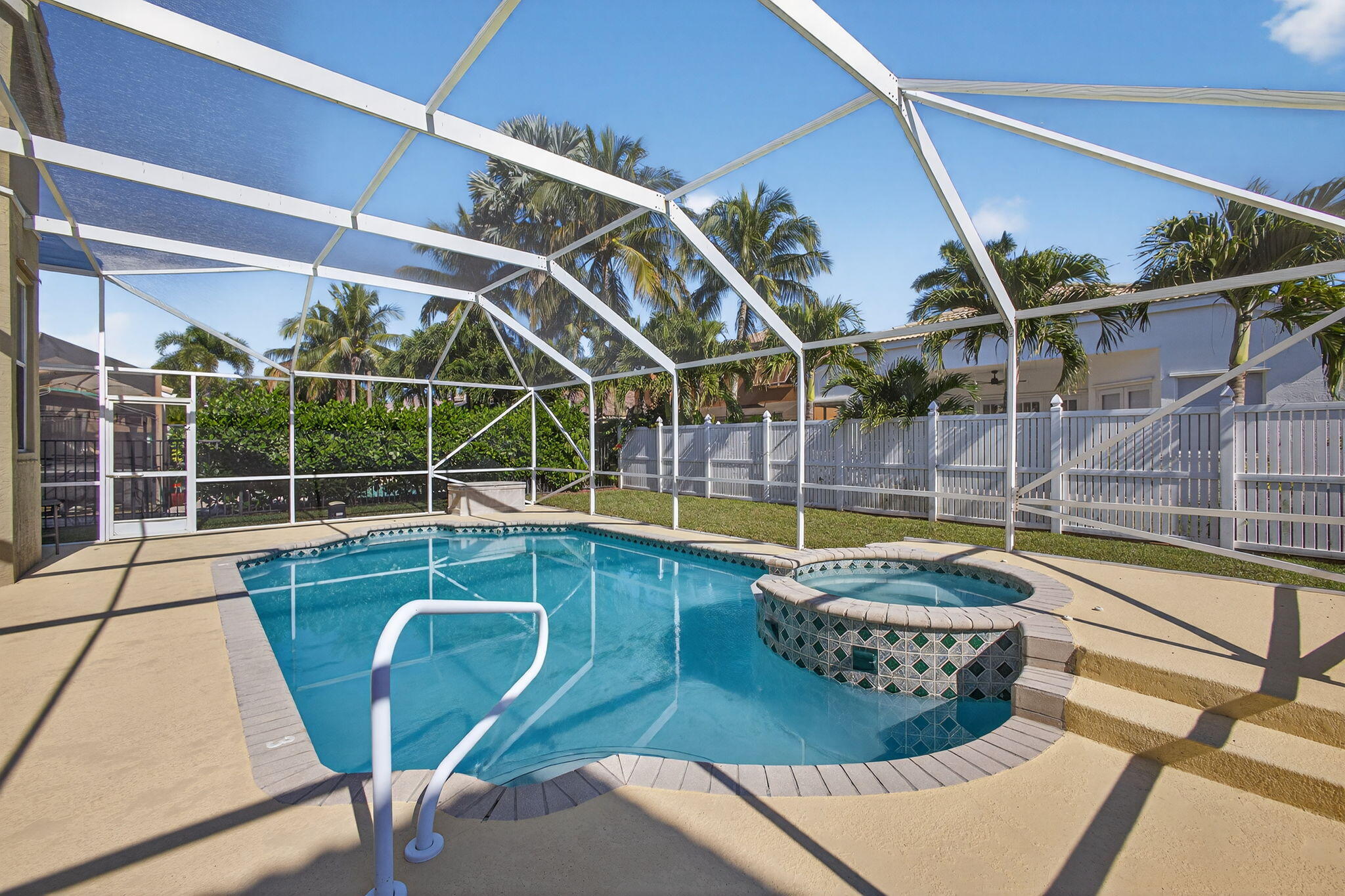 2008 Reston Circle Royal Palm Beach, FL 33411 - Photo 48 of 57 a view of a swimming pool with a lounge chairs