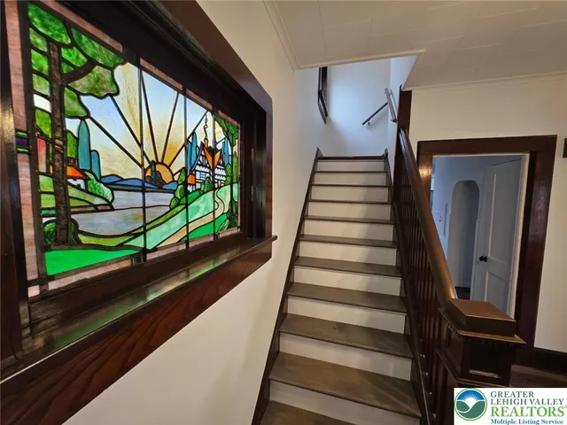 a view of entryway with wooden floor