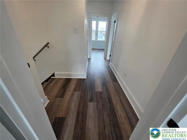 a view of a livingroom with wooden floor