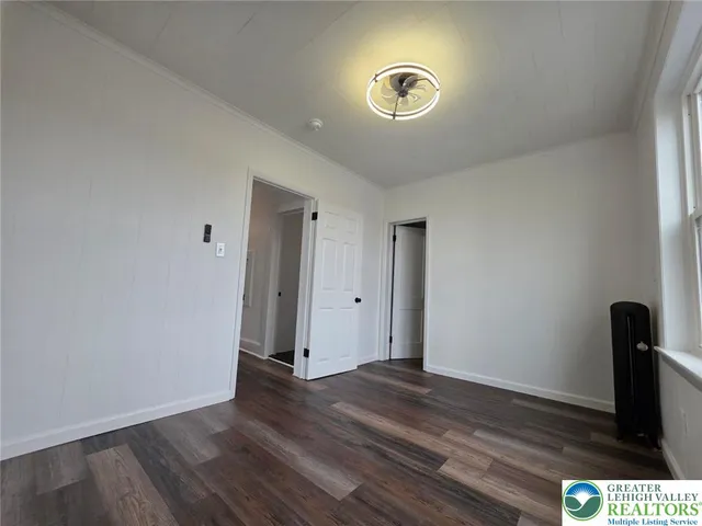 a view of wooden floor in a bedroom