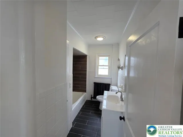 a bathroom with a sink and a bathtub