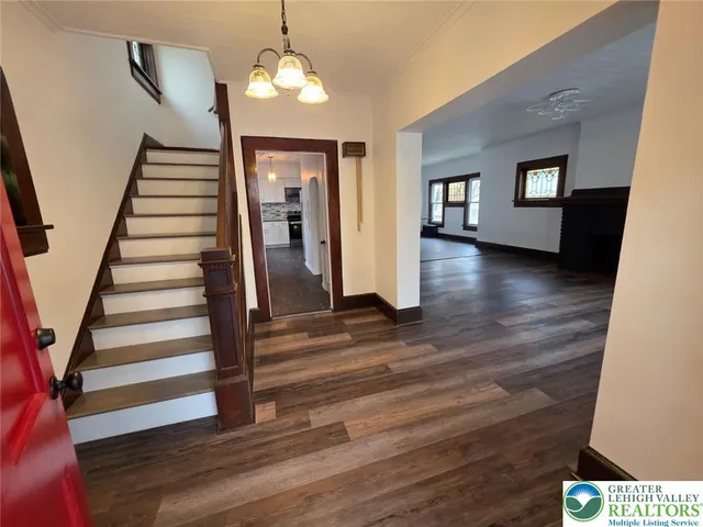 a view of a living room with furniture and a window