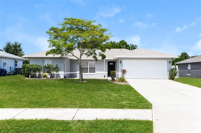 a front view of a house with a garden and porch