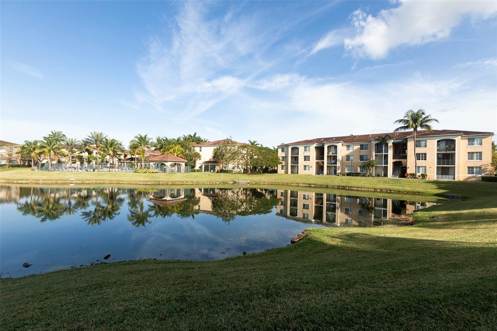 4768 West Atlantic Boulevard, Unit 3204 Coconut Creek, FL 33063 - Photo 19 of 24 an aerial view of residential houses with outdoor space and lake view