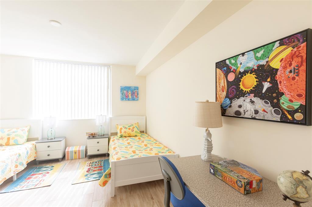 4768 West Atlantic Boulevard, Unit 3204 Coconut Creek, FL 33063 - Photo 4 of 24 a bedroom with furniture and a bed