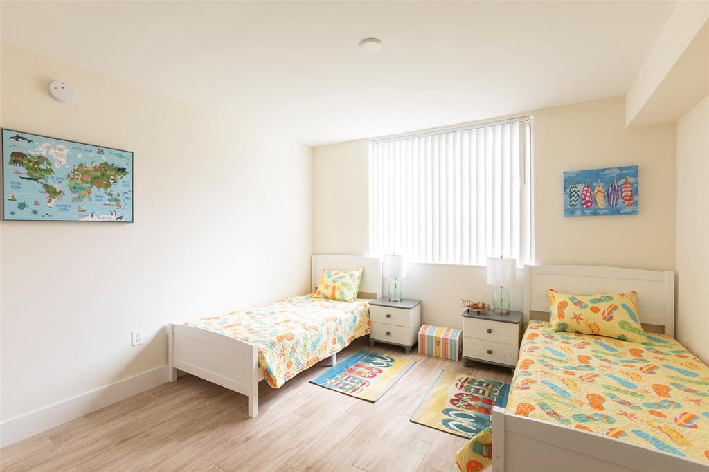 4768 West Atlantic Boulevard, Unit 3204 Coconut Creek, FL 33063 - Photo 5 of 24 a bedroom with a bed and a couch