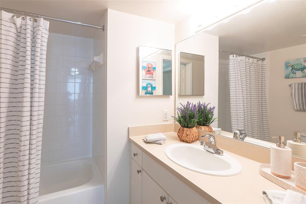 4768 West Atlantic Boulevard, Unit 3204 Coconut Creek, FL 33063 - Photo 6 of 24 a bathroom with a sink and a mirror