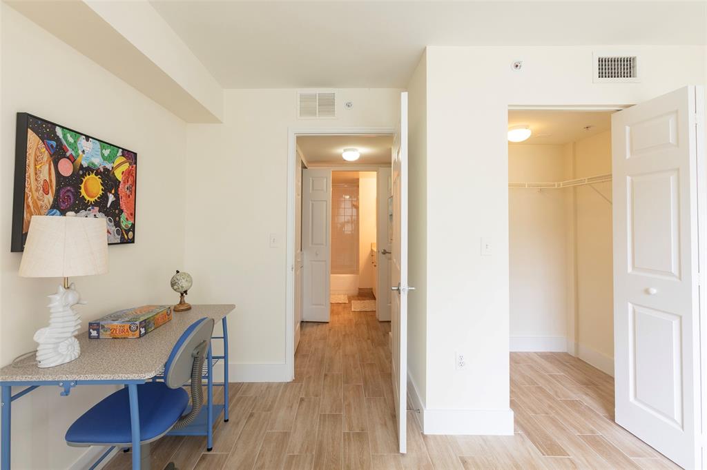 4768 West Atlantic Boulevard, Unit 3204 Coconut Creek, FL 33063 - Photo 7 of 24 a view of a dining room with furniture and wooden floor