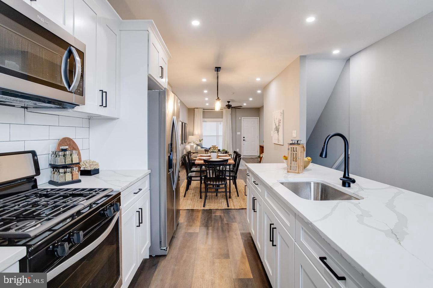 3011 Pulaski Highway Baltimore, MD 21224 - Photo 21 of 55 a kitchen with a sink stainless steel appliances and cabinets