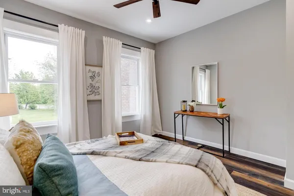 a bedroom with bed and a window