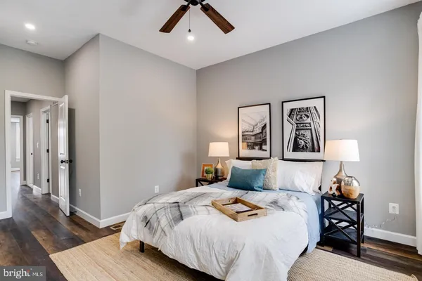 a bed room with a bed and a lamp
