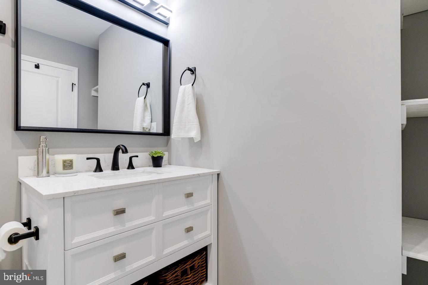 3011 Pulaski Highway Baltimore, MD 21224 - Photo 30 of 55 a bathroom with a sink and a mirror