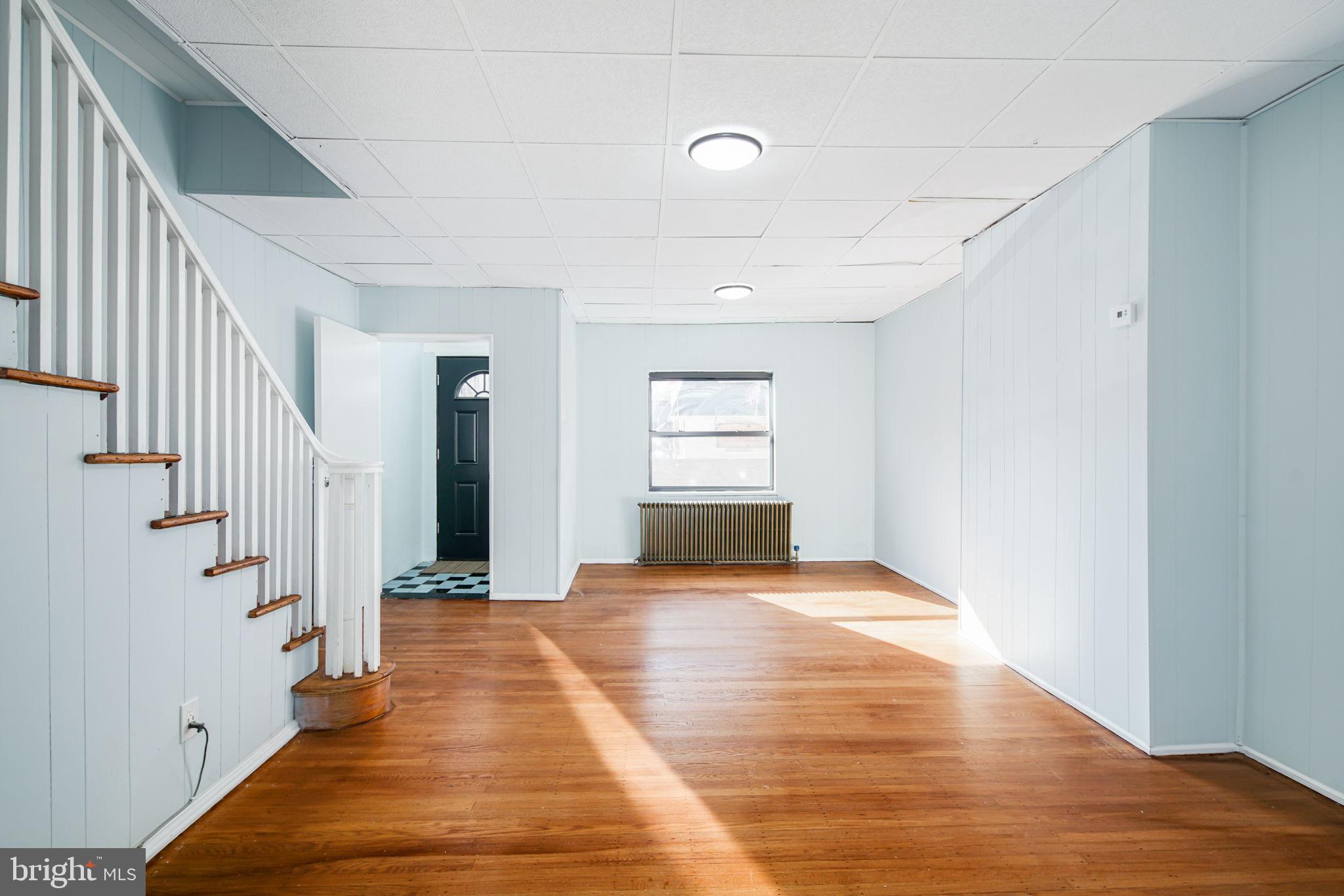 1735 Mifflin Street Philadelphia, PA 19145 - Photo 1 of 16 a view of a hallway with wooden floor and staircase